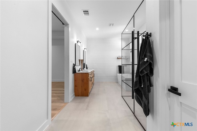 bathroom with vanity and tile patterned floors