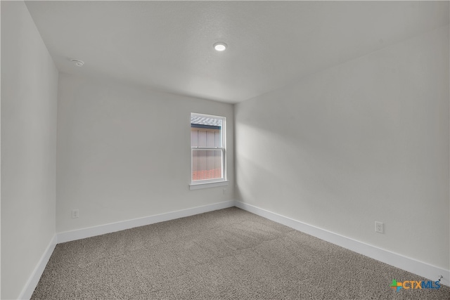 view of carpeted spare room