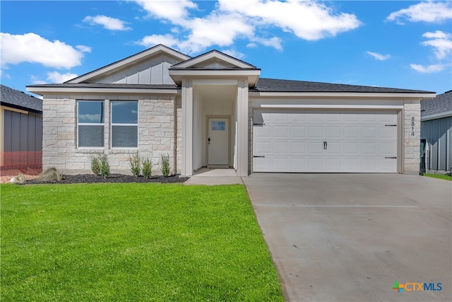 ranch-style home featuring a garage and a front lawn