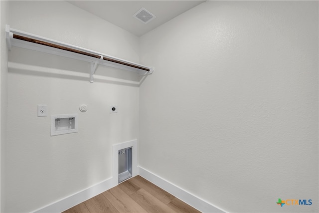 laundry area with hookup for a gas dryer, hookup for a washing machine, hookup for an electric dryer, and hardwood / wood-style flooring