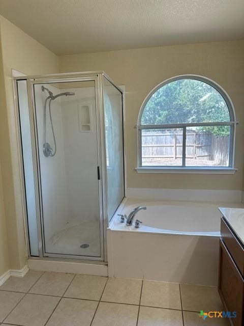 221 Roadrunner Ave, New Braunfels, TX 78130 - bathroom featuring tile patterned flooring, vanity, a stall shower, and a bath