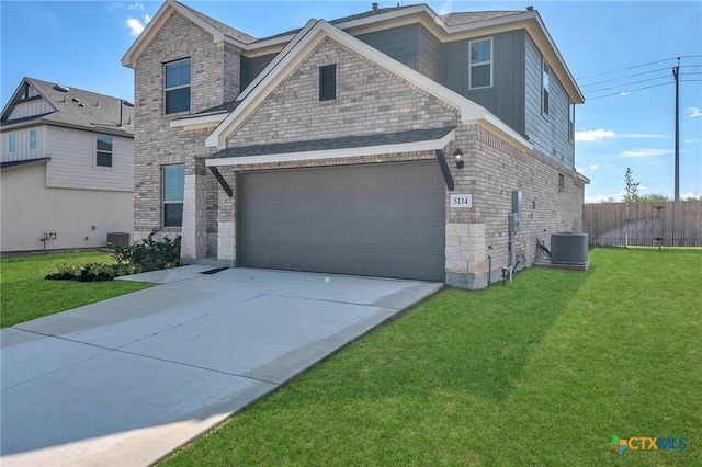 view of front facade featuring a garage, a front lawn, and central air condition unit