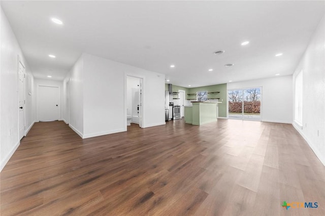 unfurnished living room with hardwood / wood-style floors