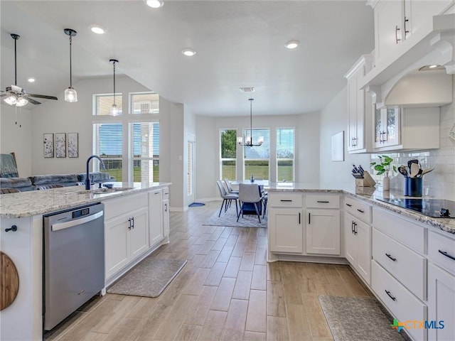 1701 Meadow Crest Dr, Salado, TX 76571 - kitchen with stainless steel dishwasher, a sink, black electric stovetop, open floor plan, and white cabinets
