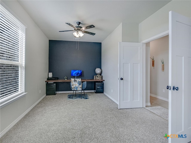 home office with carpet flooring and ceiling fan