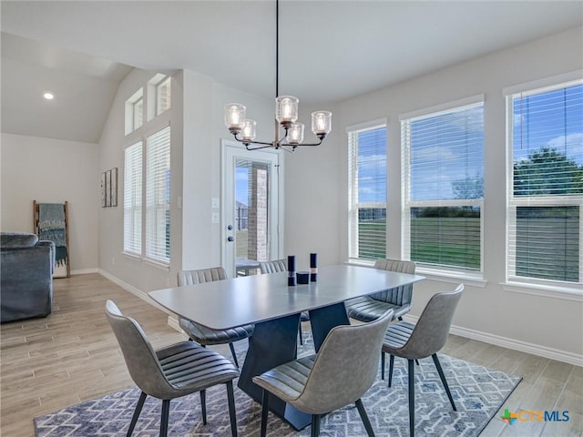 1701 Meadow Crest Dr, Salado, TX 76571 - dining space with a chandelier, light wood finished floors, baseboards, and lofted ceiling