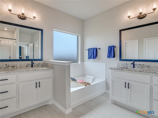 bathroom with independent shower and bath, vanity, and tile patterned flooring