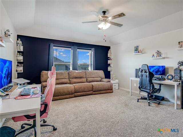 carpeted office space featuring ceiling fan and lofted ceiling