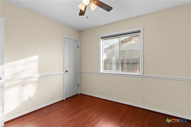 unfurnished room featuring ceiling fan and wood-type flooring