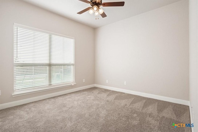 unfurnished room with carpet flooring and ceiling fan