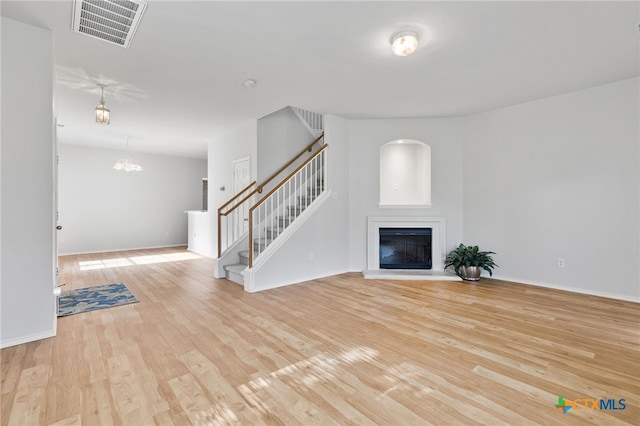 unfurnished living room featuring light wood-type flooring