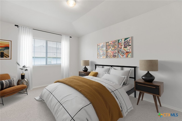 carpeted bedroom featuring vaulted ceiling