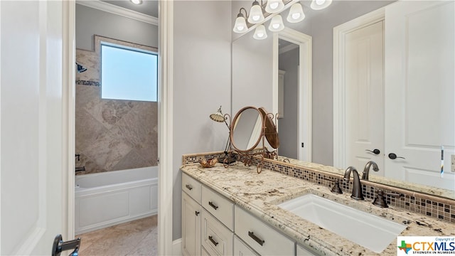 bathroom with a bath, vanity, tile patterned floors, and crown molding