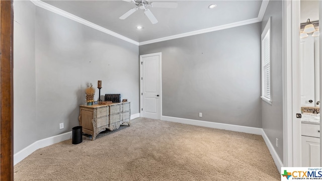 interior space with carpet floors, ceiling fan, and crown molding