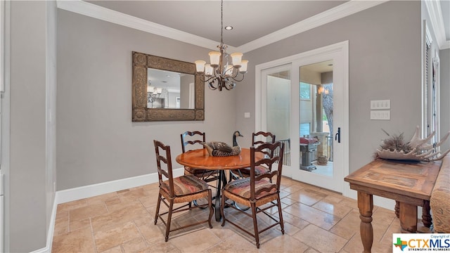 dining area with a chandelier and crown molding