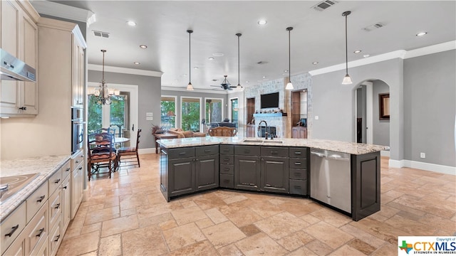 kitchen featuring stainless steel appliances, sink, ceiling fan with notable chandelier, gray cabinets, and pendant lighting