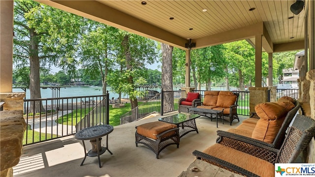 view of patio with a water view and an outdoor hangout area