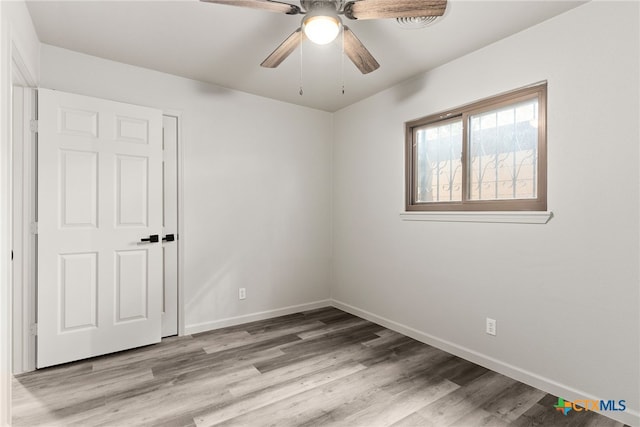 unfurnished room featuring ceiling fan and light hardwood / wood-style floors