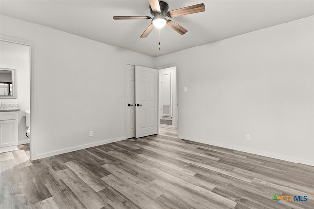 interior space with light wood-type flooring and ceiling fan