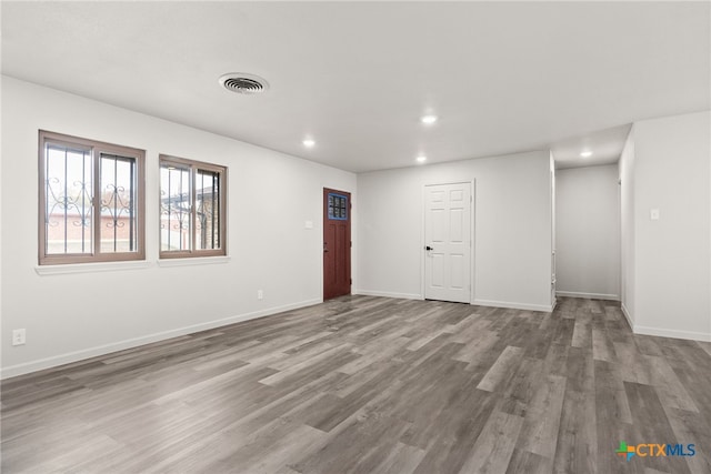 empty room featuring hardwood / wood-style flooring