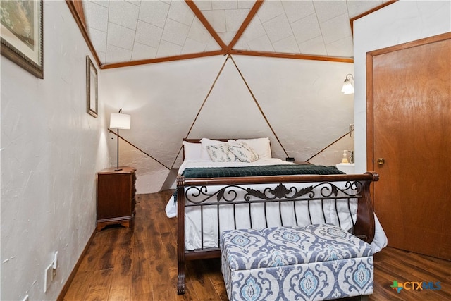 bedroom with dark wood-type flooring