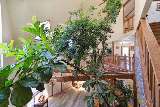 interior space featuring wood-type flooring and a notable chandelier