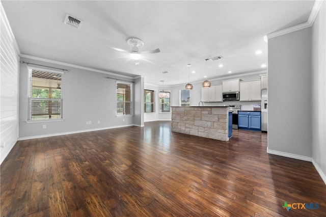5705 Fenton Ln, Belton, TX 76513 - unfurnished living room featuring crown molding, a ceiling fan, plenty of natural light, dark wood-style floors, and recessed lighting