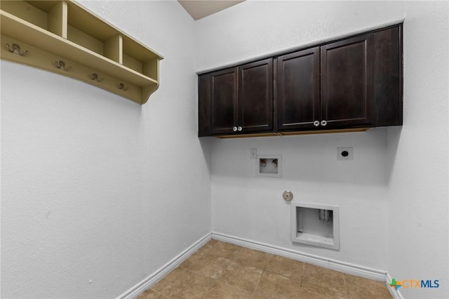 5705 Fenton Ln, Belton, TX 76513 - laundry area with hookup for an electric dryer, washer hookup, baseboards, hookup for a gas dryer, and cabinet space
