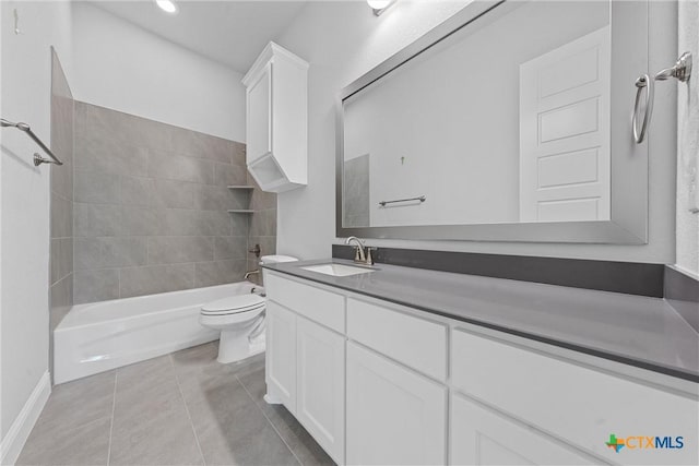 full bathroom featuring toilet, tile patterned flooring, tiled shower / bath, and vanity