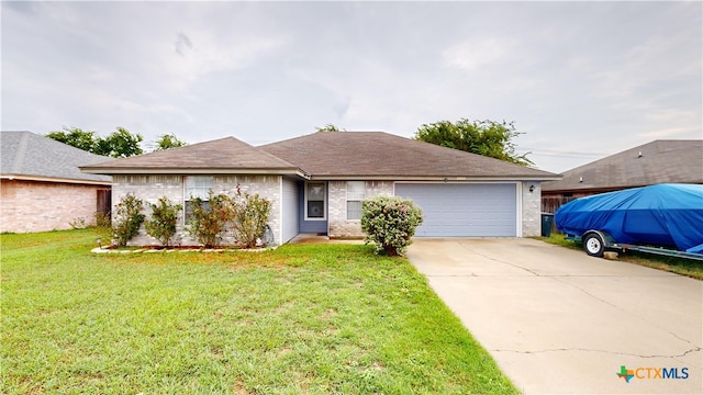 ranch-style house featuring a garage and a front lawn