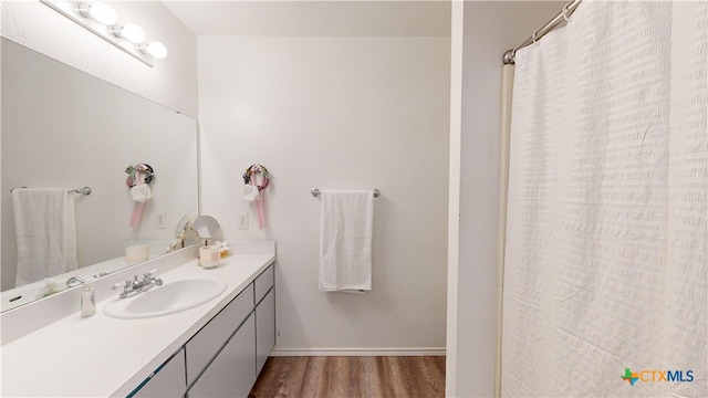 bathroom featuring vanity and hardwood / wood-style floors