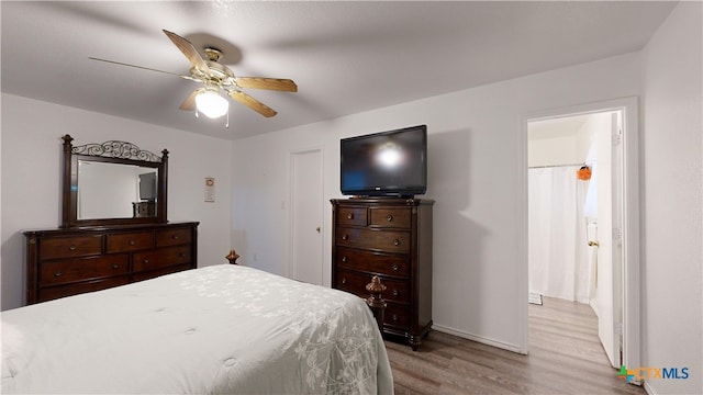 bedroom featuring light hardwood / wood-style floors and ceiling fan