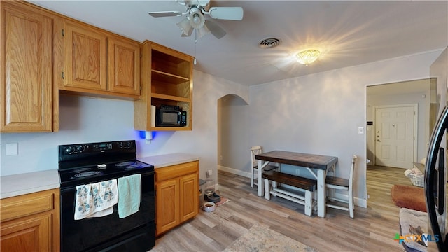 kitchen with ceiling fan, black appliances, and light hardwood / wood-style flooring