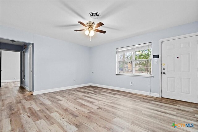 living room with ceiling fan and light wood-type flooring