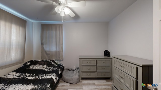 bedroom with ceiling fan and light wood-type flooring