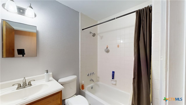 full bathroom with toilet, shower / bath combination with curtain, and vanity