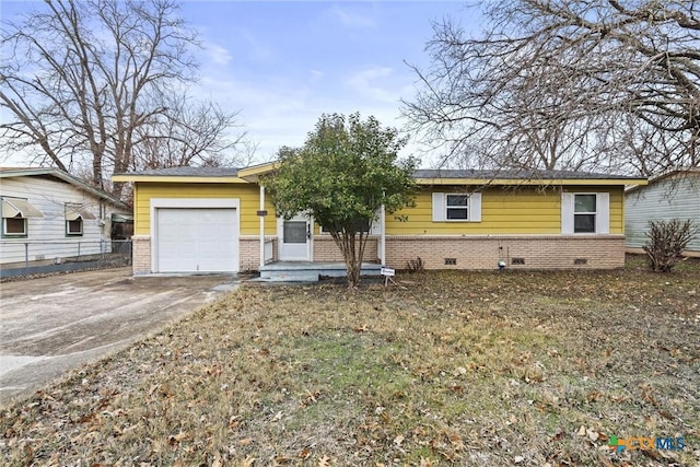 ranch-style house featuring a garage