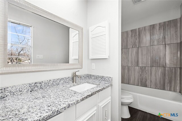 unfurnished bedroom featuring ceiling fan, carpet flooring, connected bathroom, and a textured ceiling