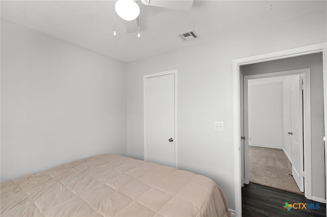 bedroom with wood-type flooring and ceiling fan