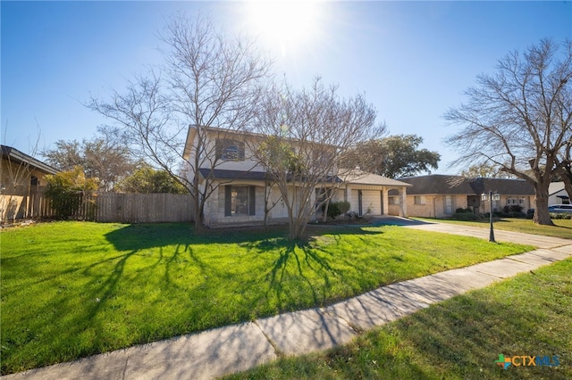 single story home with a garage and a front lawn