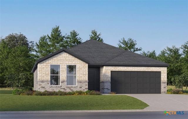 view of front of property featuring a front lawn and a garage