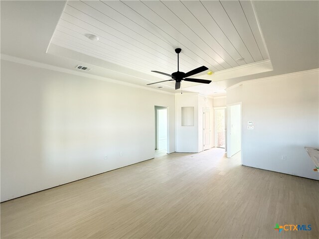 unfurnished room with crown molding, a raised ceiling, wood ceiling, and light wood-type flooring