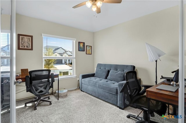 office featuring a ceiling fan and carpet flooring