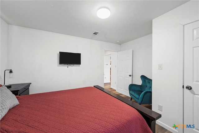 bedroom featuring hardwood / wood-style flooring