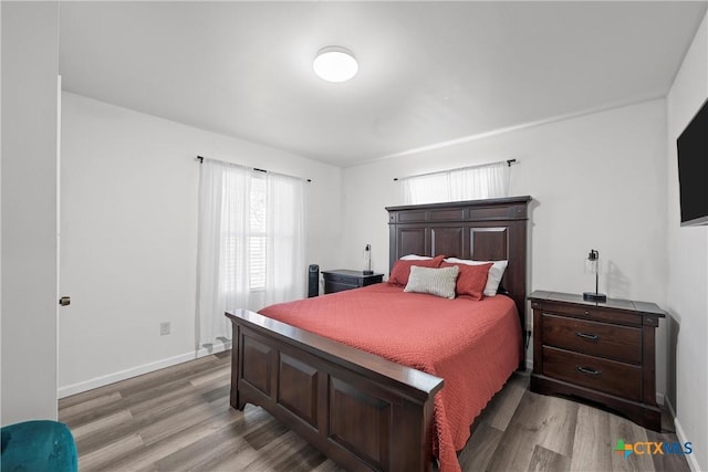 bedroom with light hardwood / wood-style floors