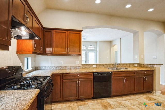 kitchen with sink, black appliances, and light stone countertops