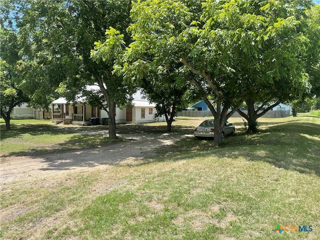 view of yard featuring covered porch