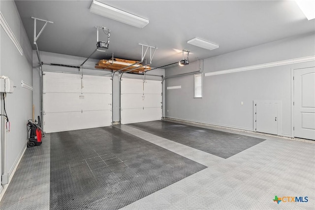 garage featuring a garage door opener