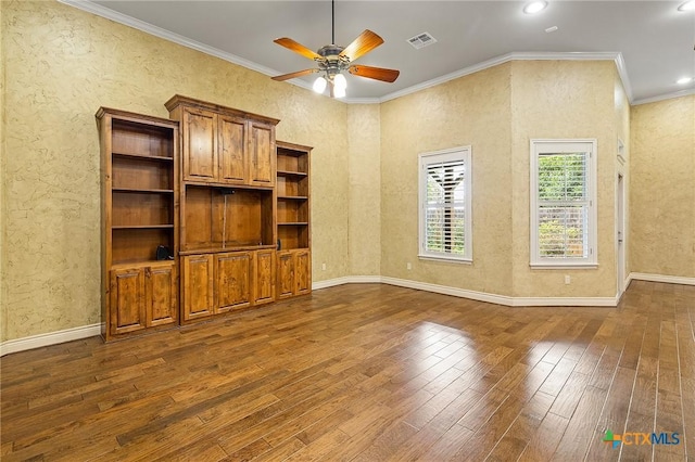 unfurnished living room with ceiling fan, ornamental molding, and dark hardwood / wood-style flooring