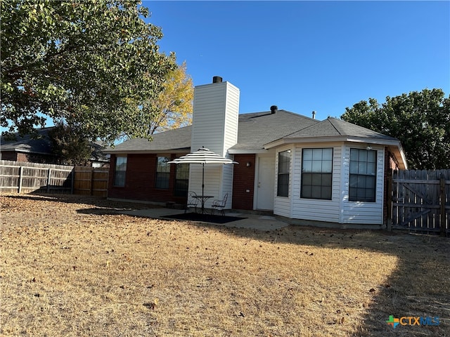 rear view of property with a patio area